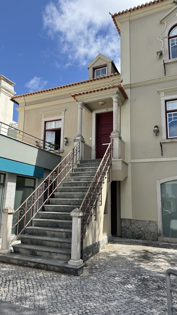 Beautiful building exterior with grand staircase and traditional architecture